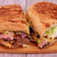 * Especial Torta · Steak, ham, cheese, sour cream, guacamole, beans, lettuce, salsa fresca.