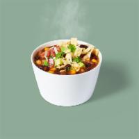 Vegetarian Chillii · Vegetarian chili with brown rice, topped with salsa fresca, aged cheddar, avocado, crispy wo...
