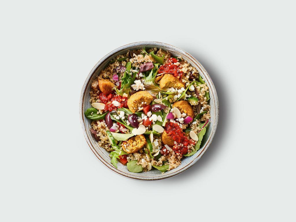 Mediterranean Bowl · Quinoa & field greens, feta cheese, kalamata olives, almonds, red onions, cucumber, roasted red peppers, tomatoes, cilantro, red pepper sauce