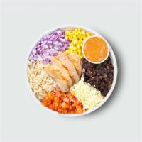 Smokehouse Bowl · Brown rice, aged cheddar, black beans, red onions, tomatoes, corn, spicy yogurt sauce