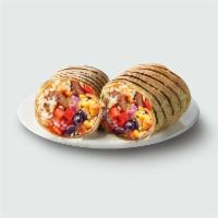 Smokehouse Burrito · Brown rice, aged cheddar, black beans, red onions, tomatoes, corn and spicy yogurt sauce, gr...