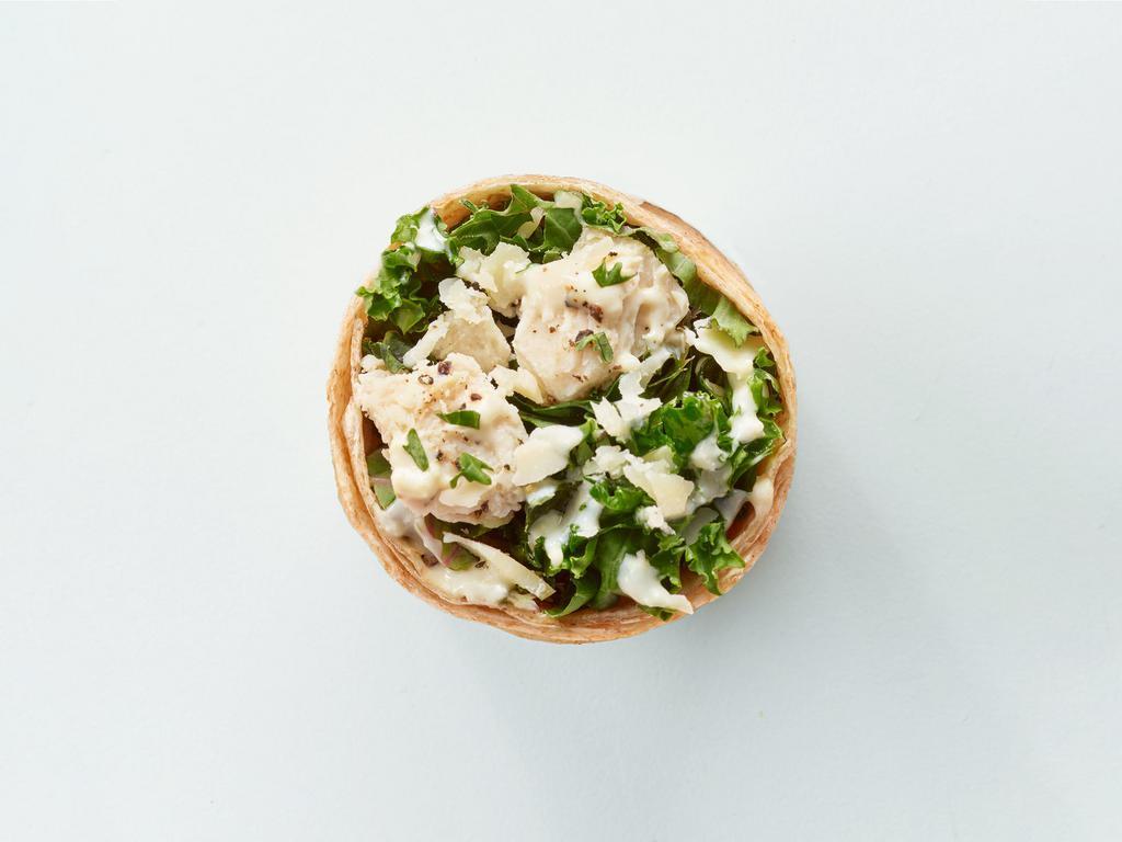 Kale Caesar Wrap · Kale, quinoa, crispy chickpeas, parmesan cheese, hemp seeds, greek yogurt caesar dressing.