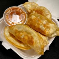 Pot Stickers Pork · 6 pieces of thin pastry shells filled with pork and mixed vegetables. Deep-fried and served ...
