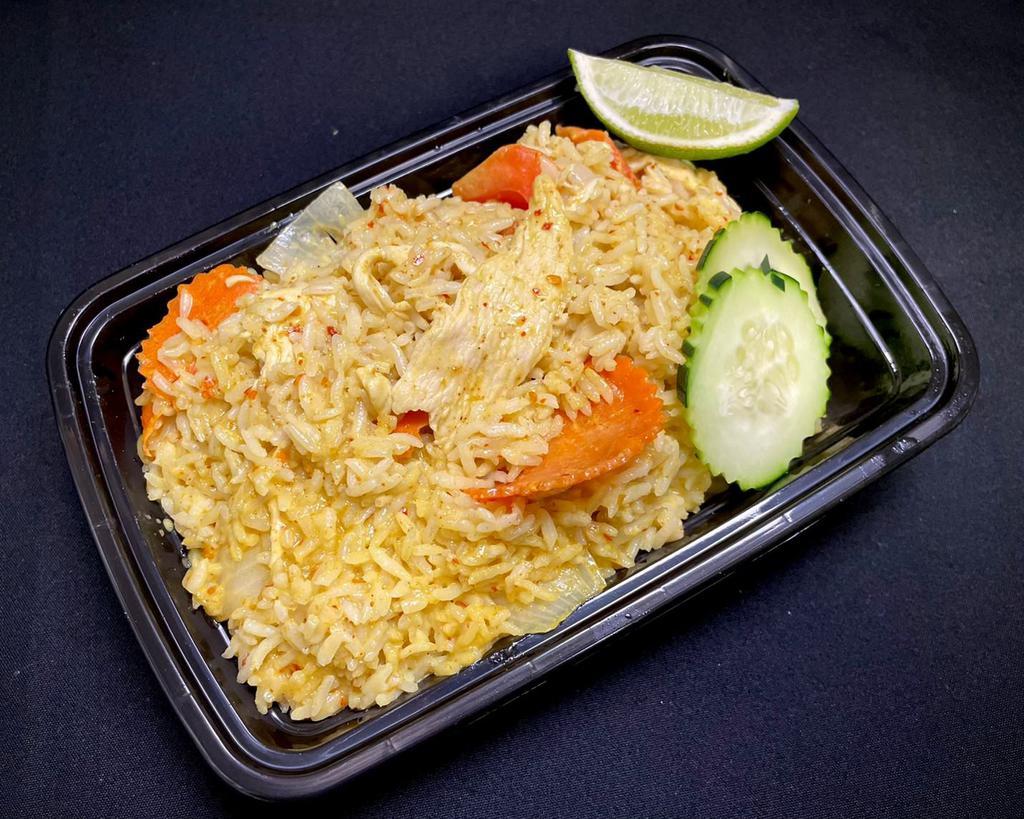 Yellow Curry Fried Rice · Gluten-free. Jasmine fried rice with yellow curry sauce, coconut milk, onions, bell peppers, and carrots.
