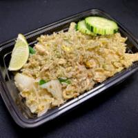 Garlic Fried Rice · Jasmine fried rice with garlic and cilantro Thai pesto, eggs, onions, and green onions.

