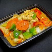 Stir Fried Yellow Curry · Stir-fried spiced yellow curry cooked in coconut milk with eggs, onions, green onions, bell ...