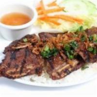 C4. Com Suon Bo Nuong  · Steamed rice with grilled short ribs.