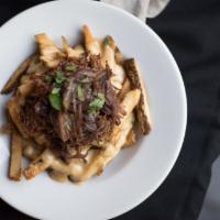 Twisted Fries · Habanero blue cheese, braised shortribs and beer onion.