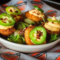 Not Your Mama's Deviled Eggs · Five lightly fried deviled eggs with a spicy filling, crumbled bacon & garnished with a fres...