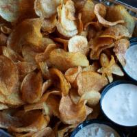 Housemade Chips & Dip · Thinly sliced housemade chips served with a variety of dips