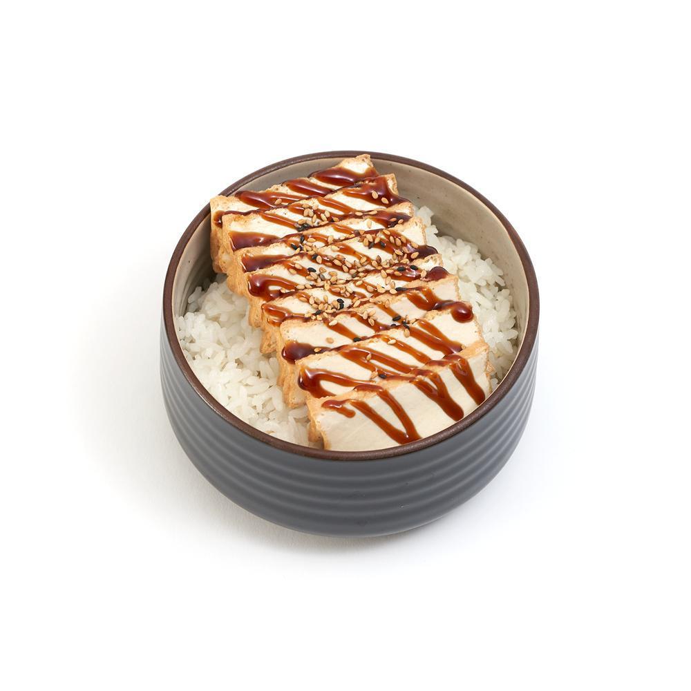 Tofu Teriyaki Bowl · Flash-fried organic tofu steak, served with
our signature sauce on a bed of rice.