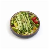 Cucumber Salad · Large garden salad topped with a generous portion of cucumber.