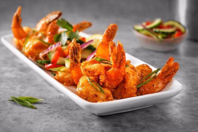 Spicy Shrimp · Succulent large shrimp, lightly fried, tossed in a spicy cream sauce, and served with a tangy cucumber salad. Spicy.