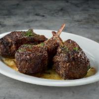 Lamb Chops* · Three extra thick chops marinated overnight with fresh mint.
