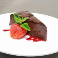 Chocolate Sin Cake · rich flourless cake, ganache, raspberry sauce