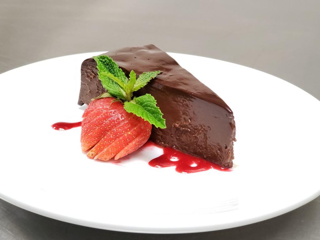 Chocolate Sin Cake  · rich flourless cake, ganache, raspberry sauce
