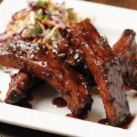 Root Beer Glazed Ribs · Five slow-roasted baby back pork ribs, BJ's Handcrafted Root Beer glaze, spicy sriracha slaw...