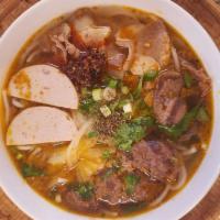 Hue Style Rice Noodle · Served with beef, pork & Vietnamese ham. Bun bo hue.