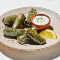 Stuffed Grape Leaves · Grape leaves stuffed with rice, onion and spices. Served with Garlic Feta Sauce. (340 Cals) 