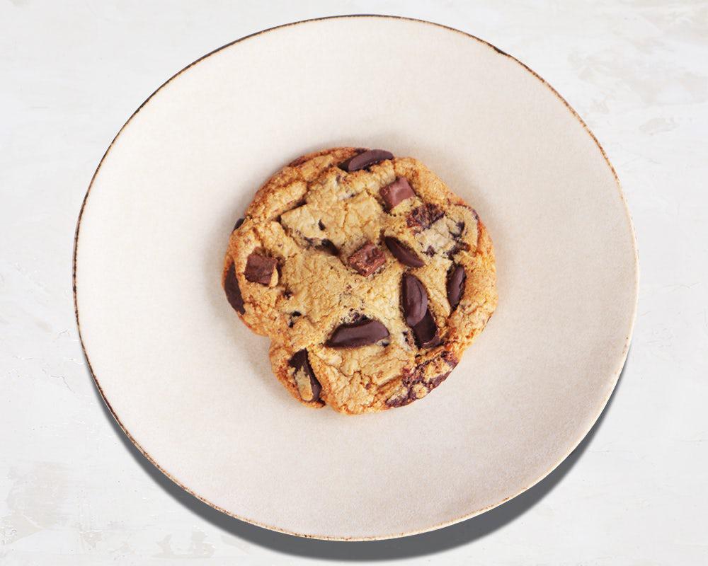 Chocolate Chunk Cookie · A brown butter, caramelized, chewy-crisped-edged chocolate chip wonder to shower your tastebuds with amazement. Free of GMO’s, additives and artificial colors and made with only pure cane sugar and cage free eggs.