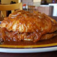 Torta Ahogada · Inside: choice of protein and beans. Wet in mild or spicy sauce and onions.