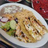 Shrimp Tacos Gobernador · 1 quesadilla style taco filled with cheese, shrimp, tomatoes, onions and cilantro.