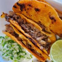 Birria Tacos Gobernador · 3 quesadilla style tacos on a large corn tortilla, filled with cheese and birria.