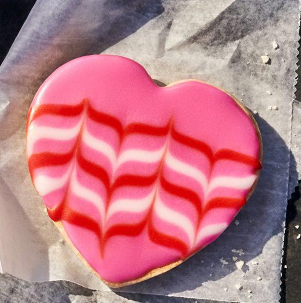 Valentine Cookie · 430 Cal. Freshly baked all-butter shortbread cookie shaped like a heart and decorated for Valentine's Day. Allergens: Contains Wheat, Milk