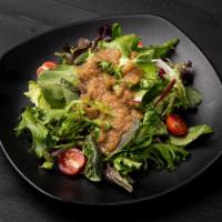 House Salad · Baby mixed greens, baby arugula, kale and cherry tomatoes topped with our original house Jap...
