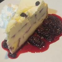 TOGO Blueberry Cobbler Cheesecake · white chocolate, whipped cream, warm berry compote