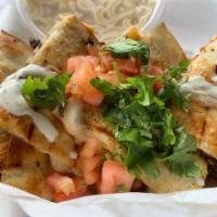 Laura's Pollo Loco Quesadilla · The unassuming quesadilla that fits the budget and takes you to a happy place. Made with shr...