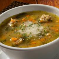 Wedding Soup · A classic Italian Wedding soup with orzo pasta, meatballs, spinach and parmesan cheese

