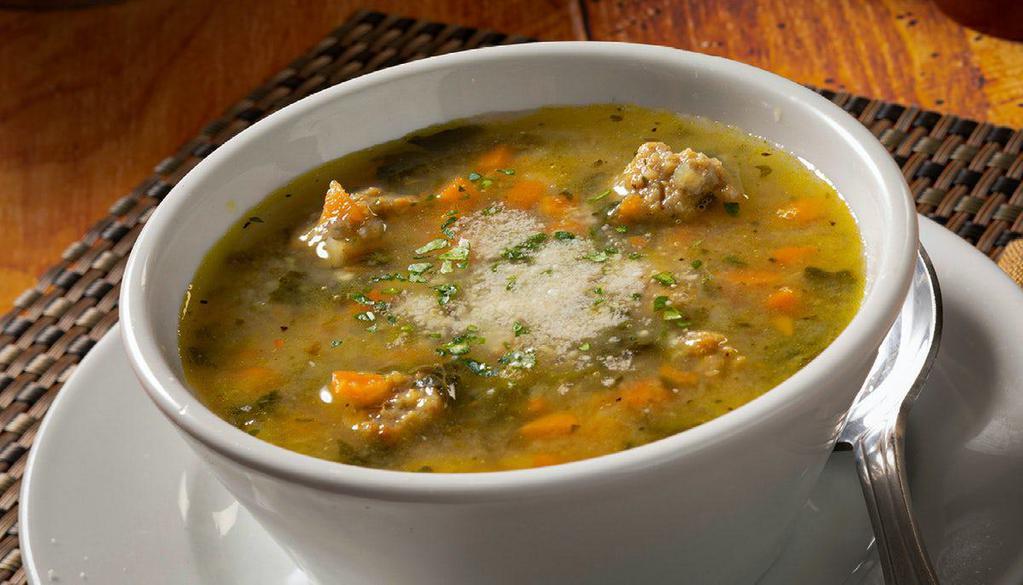 Wedding Soup · A classic Italian Wedding soup with orzo pasta, meatballs, spinach and parmesan cheese

