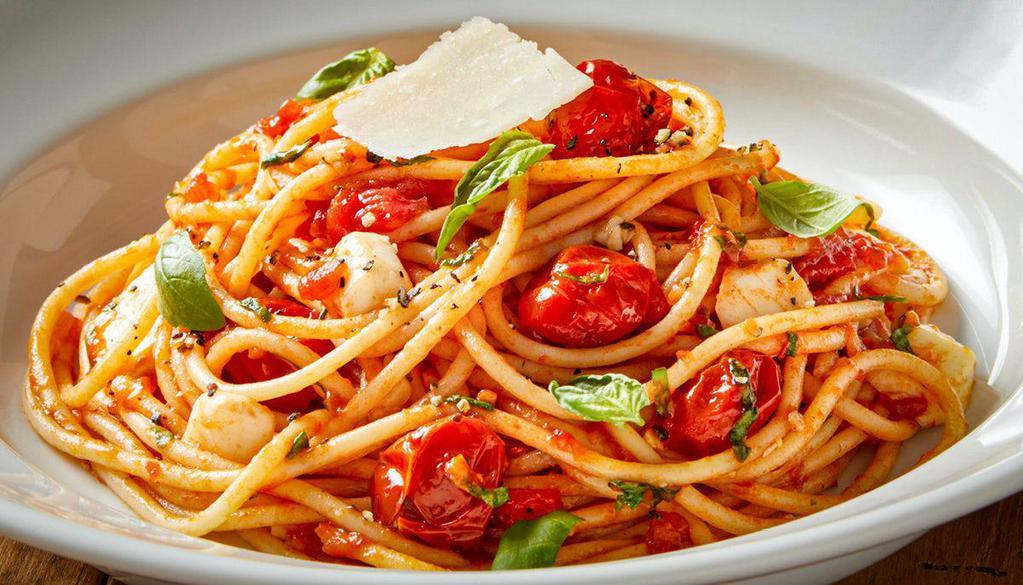 Spaghetti Pomodoro · House-made tomato compote, basil, parmesan 
