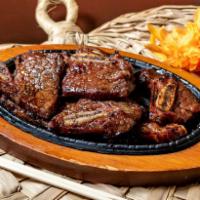 Kalbi Entree · Prime short ribs marinated in house special sauce.