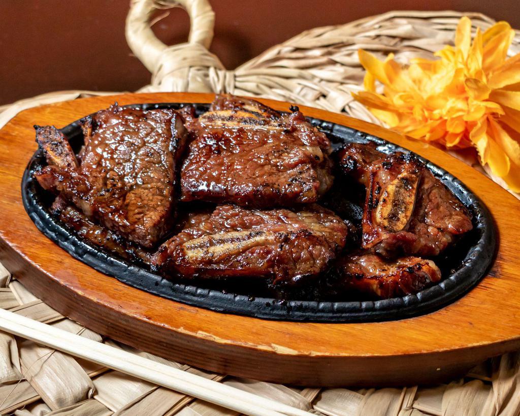 Kalbi Entree · Prime short ribs marinated in house special sauce.