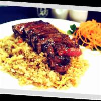 Teriyaki Fried Rice · Choice of chicken, beef or shrimp with egg, sesame seeds, diced onions and carrots. Served w...