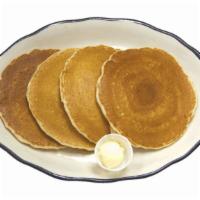 Hot Cakes · Order of four old-fashioned buttermilk hotcakes with butter and syrup.