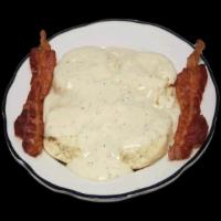 Biscuits and Gravy Breakfast · Two freshly baked buttermilk biscuits with country gravy and bacon or sausage.