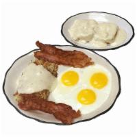Country Breakfast · Three eggs cooked to order, sausage or bacon, hash browns covered with country gravy, and a ...