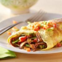 Vegetarian Omelette · Three egg omelette with tomato, onions, zucchini, mushrooms, bell peppers, cheese and avocad...