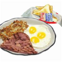 #8 Ham & Eggs · Grilled ham steak, three eggs cooked to order, hash browns and buttered toast with jelly.