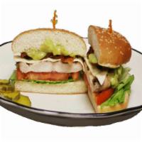 California Chicken Sandwich · Charbroiled chicken breast, bacon, Swiss cheese, mayonnaise, lettuce and tomato on a sesame ...