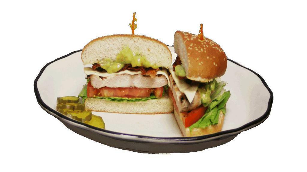 California Chicken Sandwich · Charbroiled chicken breast, bacon, Swiss cheese, mayonnaise, lettuce and tomato on a sesame seed bun.
