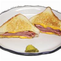 Grilled Ham & Cheese Sandwich · Grilled ham and American cheese on grilled white bread.