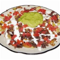 Carne Asada Fries · Prepared with carne asada, cheese, grilled onion, tomato, sour cream and guacamole.
