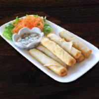 Island Finger Lumpias · Deep-fried spring rolls filled with chicken and shrimp and served with plum sauce.
