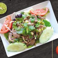 Beef Salad · Grilled beef in a salad of tomatoes, lemon grass, kaffir lime leaves, mint leaves, ground ro...