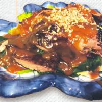 Roasted Duck with Peanut Sauce · Roasted Duck. Served with steamed vegetables topped with peanut sauce and ground peanut.