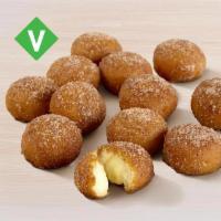 Cinnabon Delights® 12 Pack · Warm donut holes filled with Cinnabon® signature cream cheese frosting, and dusted in Makara...